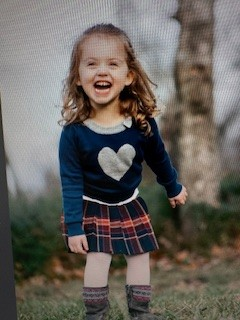 Little Reagan in her heart dress