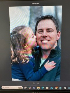 Reagan giving dad a sweet kiss